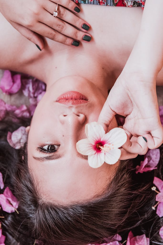 Mésothérapie - Photo of Woman Holding Pink Flower