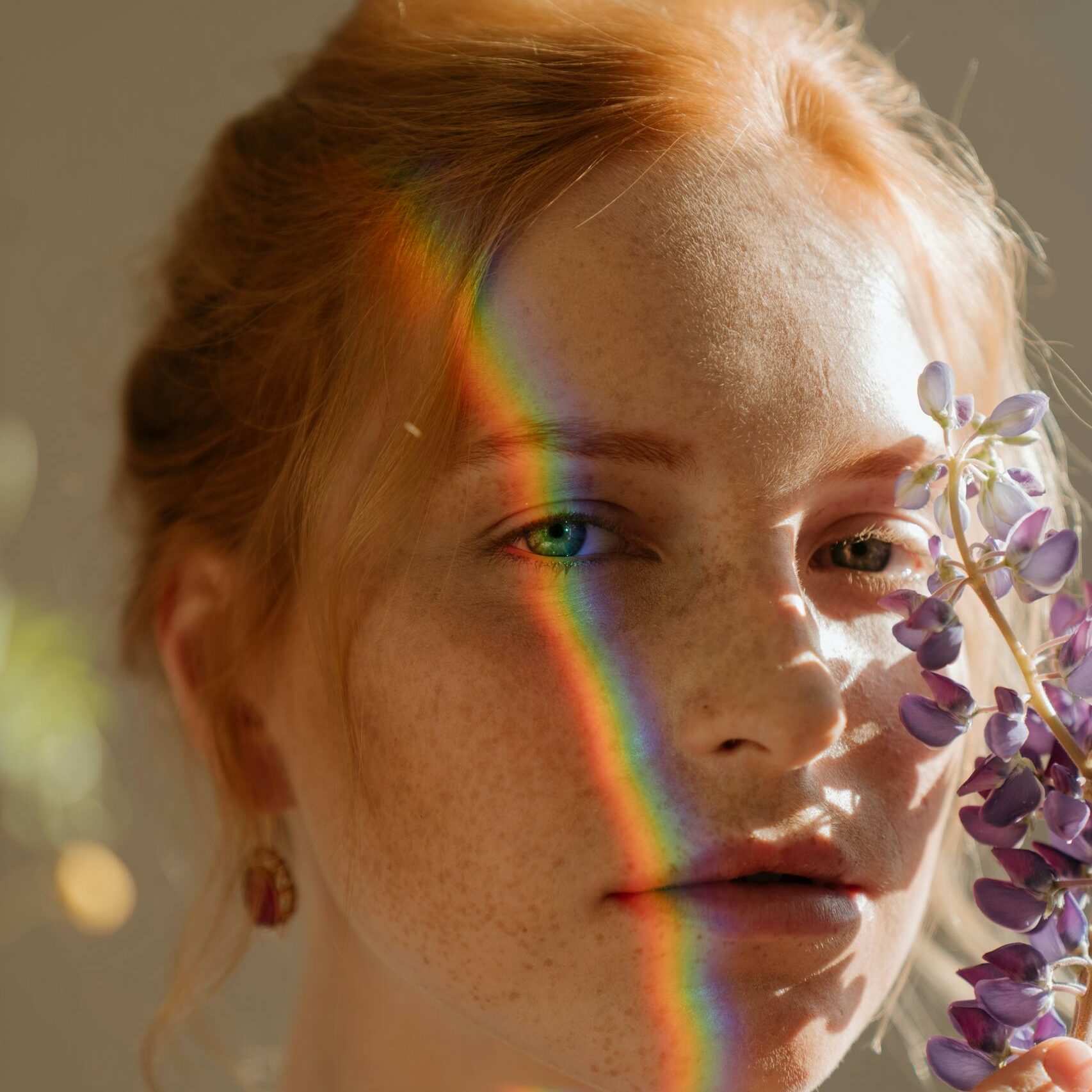 Woman With Blue and White Flower on Her Face